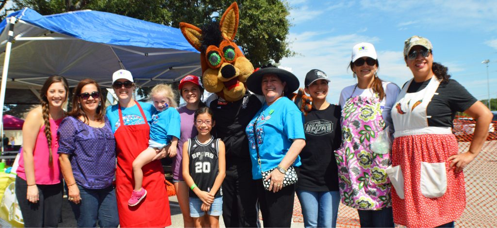 volunteers with coyote at festival